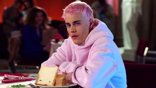 Justin Bieber wearing a pink hoodie